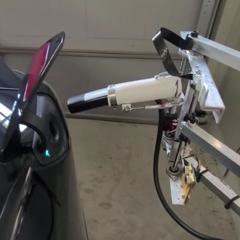 Watch This Tesla Owner's DIY Robo-Charger Stick Its Landing