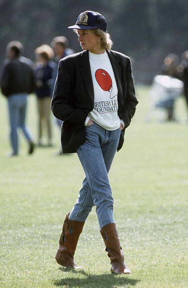 windsor, united kingdom   may 02  diana, princess of wales at guards polo club  the princess is casually dressed in a sweatshirt with the british lung foundation logo on the front, jeans, boots and a baseball cap  photo by tim graham photo library via getty images