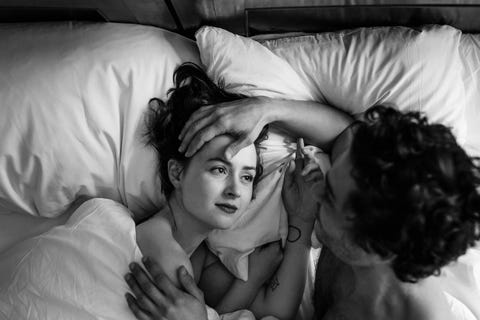 Couple In Hotel Bed