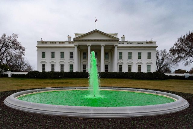 the water in the fountain on the north lawn of the white house is seen dyed green for st patrick's day in washington, dc, on march 17, 2021 photo by jim watson  afp photo by jim watsonafp via getty images