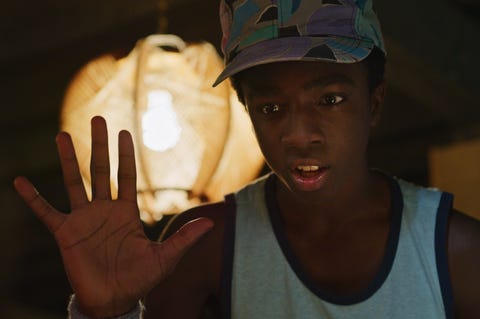 Stranger Things season 3, Caleb McLaughlin as Lucas caleb mclaughlin as lucas, holding his right hand up to the camera, in a photo from stranger things season 3