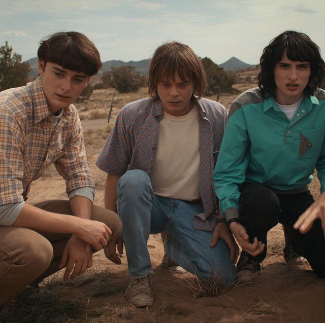 stranger things l to r noah schnapp as will byers, charlie heaton as jonathan byers, finn wolfhard as mike wheeler, and eduardo franco as argyle in stranger things cr courtesy of netflix © 2022