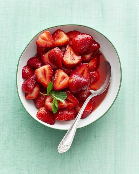 sweet strawberries in bowl with mint