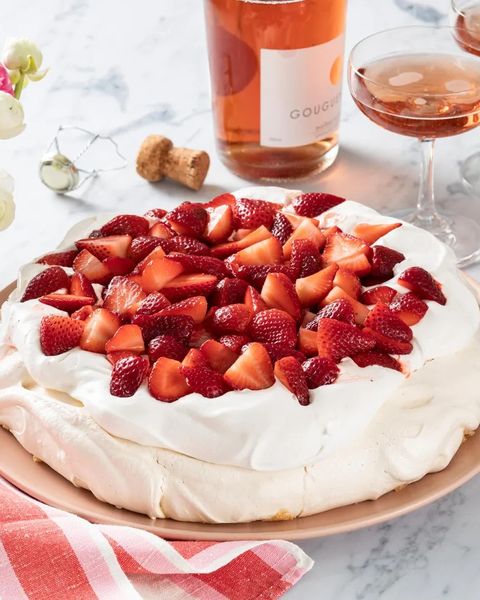 strawberry pavlova with rose wine in back