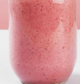 strawberry smoothies on a pink background