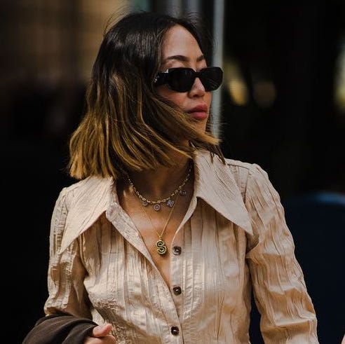 two women photographed during fashion week to illustrate a roundup of nordstrom anniversary sale 2022 early deals