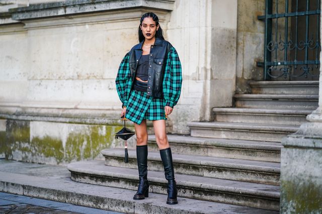 paris, france   october 01 aleali may wears a black leather jacket with green checkered pattern print large sleeves, a black crop top, a skirt, black leather thigh high boots, a vuitton toupie bag minaudière, outside louis vuitton, during paris fashion week   womenswear spring summer 2020, on october 01, 2019 in paris, france photo by edward berthelotgetty images