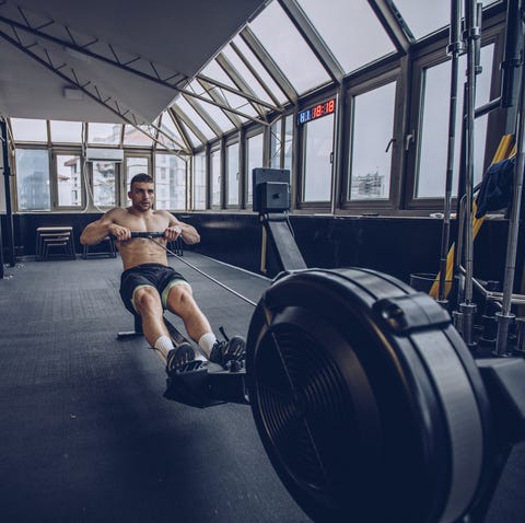 Rowing Workout: Best Rowing Workout Strong man exercising in gym