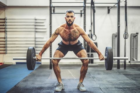 Strong man is doing  cross training exercise
