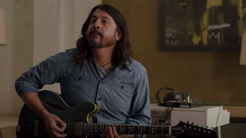 dave grohl plays the guitar in a scene from studio 666