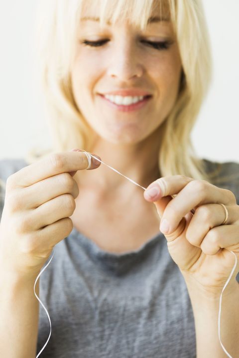Flossing - New Year's Resolution Ideas