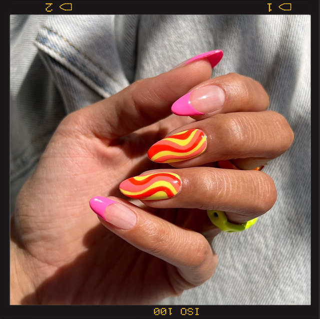 two hands wearing summer nail designs, the one on the left with blue and purple nails with a butterfly on top and the hand on the right with pink french tips and wavy orange and yellow lines on the middle and ring fingers