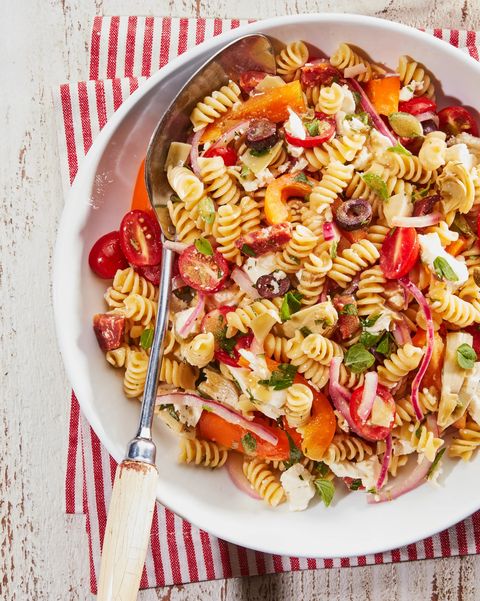basic pasta salad recipe in a bowl with a vintage serving spoon