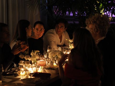 top speakers and friends from the fashion house have dinner together