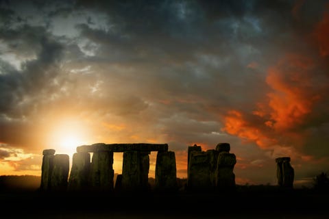 Rising sun over Stonehenge, Wiltshire, UK