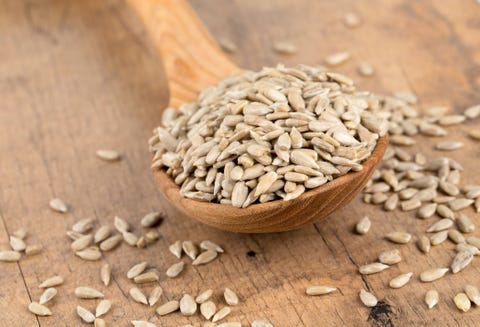 sunflower seeds in a wooden spoon