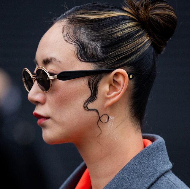 london, england   february 20 betty bachz seen wearing orange blazer, brown pants, grey oversized wool coat, sunglasses, wet styled hair outside david koma during london fashion week february 2022 on february 20, 2022 in london, england photo by christian vieriggetty images