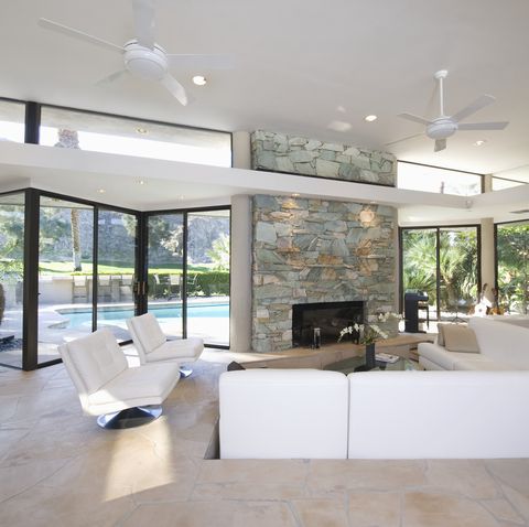 Sunken seating area and exposed stone fireplace of Palm Springs home