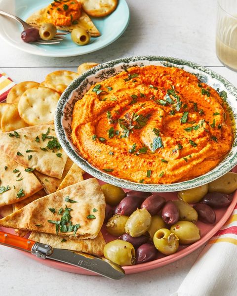 super bowl dips roasted red pepper hummus with pita and olives