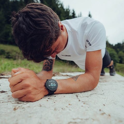 man planking outside wearing suunto race al black watch