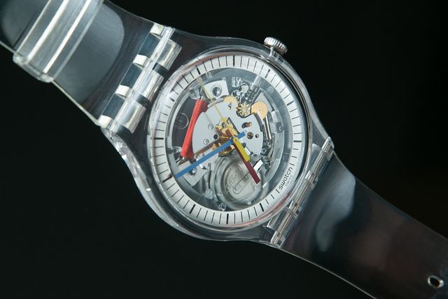 clear plastic watch against black backgound