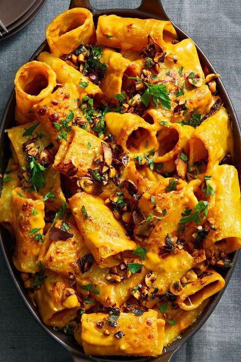 sweet potato baked pasta with hazelnuts on top in a dish