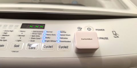 switchbot placed on a washing machine