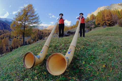 Switzerland, Zermatt, two alphorn players near Matterhorn