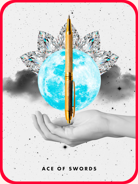 the tarot card the ace of swords, showing a hand holding a gold pen
