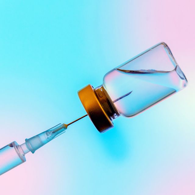 syringe and coronavirus vaccine