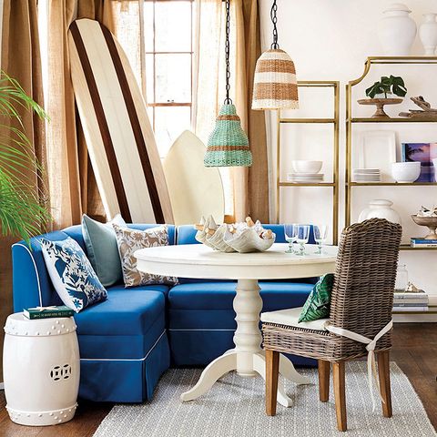 white table with blue banquette