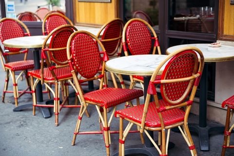 tables and chairs at traditional parisian sidewalk cafe, paris, france