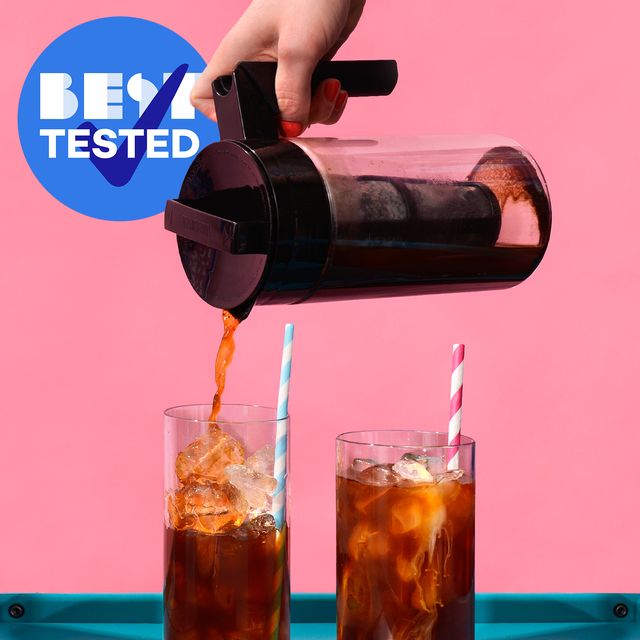pouring coffee from takeya cold brew maker into glass cups with ice