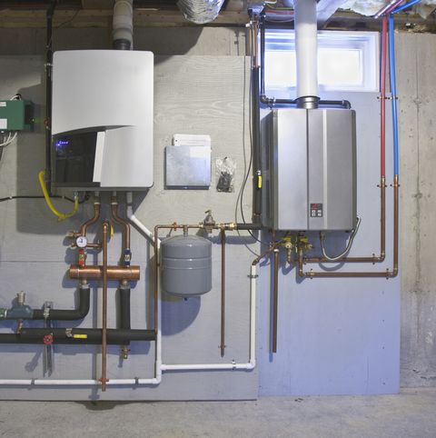 tankless hot water system in the basement of a green technology home