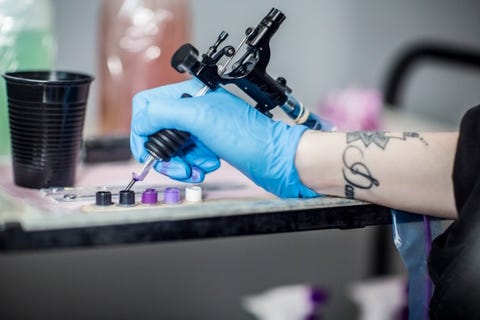 tattoo artist in studio preparing