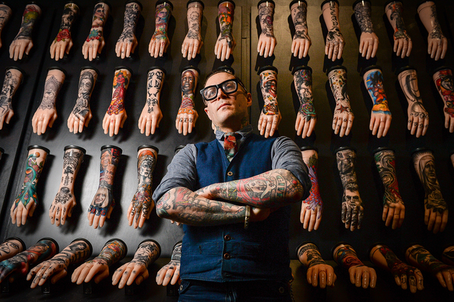 exhibition curator, dr matt lodder in front of one hundred silicone arms on display at the national maritime museum in falmouth, cornwall, part of the exhibition tattoo british tattoo art revealed photo by ben birchallpa images via getty images