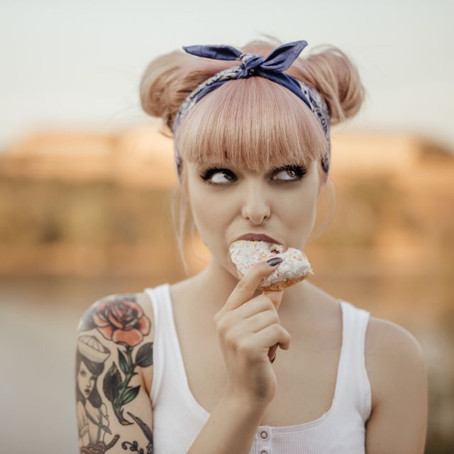 Tattooed girl posing for social media