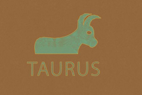 taurus horoscope sign in paper craft brown background
