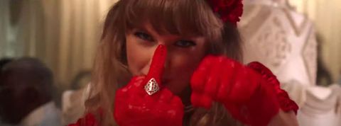 taylor swift wearing a ring that says red in the i bet you think about me music video