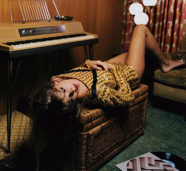 taylor swift laying on a chair for her new album midnight photoshoot