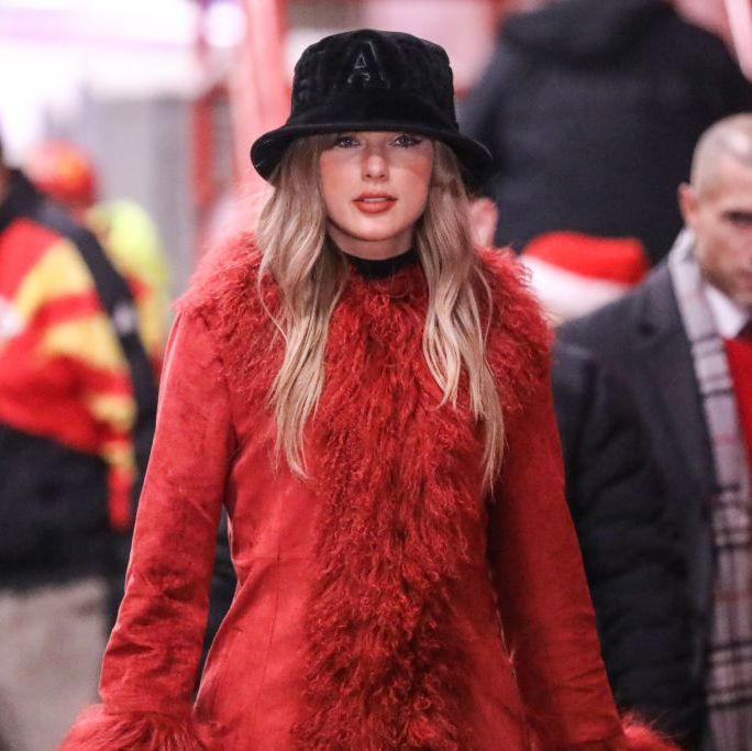 Taylor Swift Wears a Faux Fur Red Coat and Black Bucket Hat to Watch Travis Kelce and the Chiefs