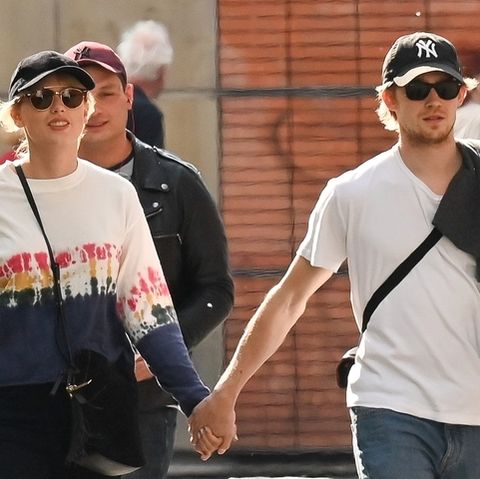 Taylor Swift and Joe Alwyn walking through Paris.