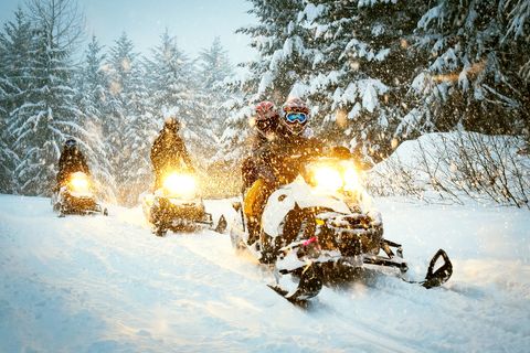 snow mobile rides in idaho's shore club lodge in winter