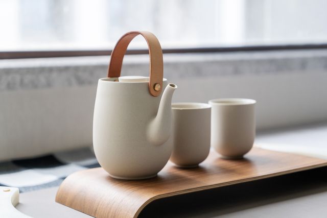 tea cup and tea pot on table