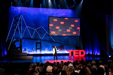 luvvie performing her ted talk “getting comfortable with uncomfortable” in 2017 on the ted stage