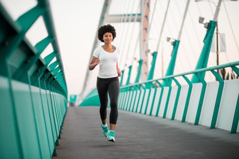 marathon runners teen girl exercising on bridge