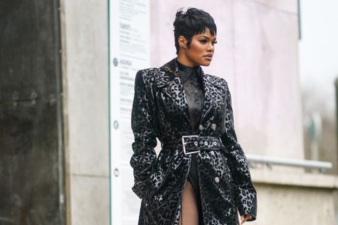 paris, france   february 26 teyana taylor wears a black shirt, a black and gray leopard print long trench coat with a large belt, outside mugler, during paris fashion week   womenswear fallwinter 20202021, on february 26, 2020 in paris, france photo by edward berthelotgetty images
