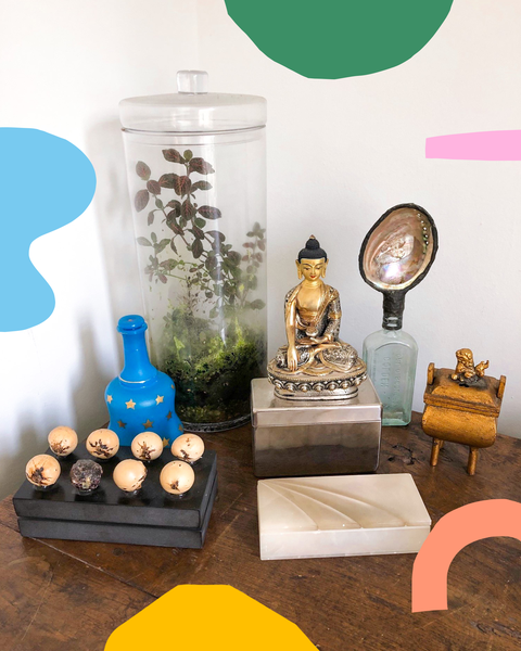 liz gilberts terrarium and other miscellaneous items that she keeps on her desk