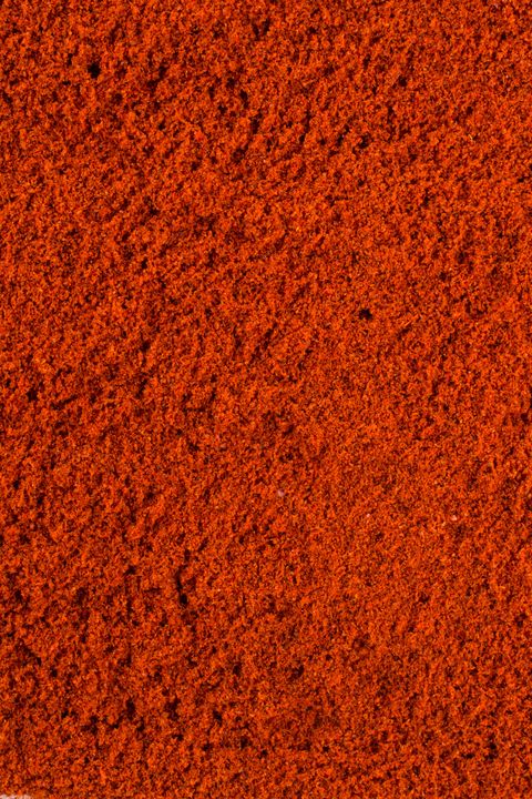 Texture background. Red paprika powder Top view