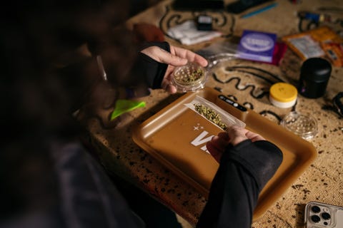 A Rage and Release member rolling a joint before a local run on December 19 2021 a rage and release member rolling a joint before a local run on december 19 2021